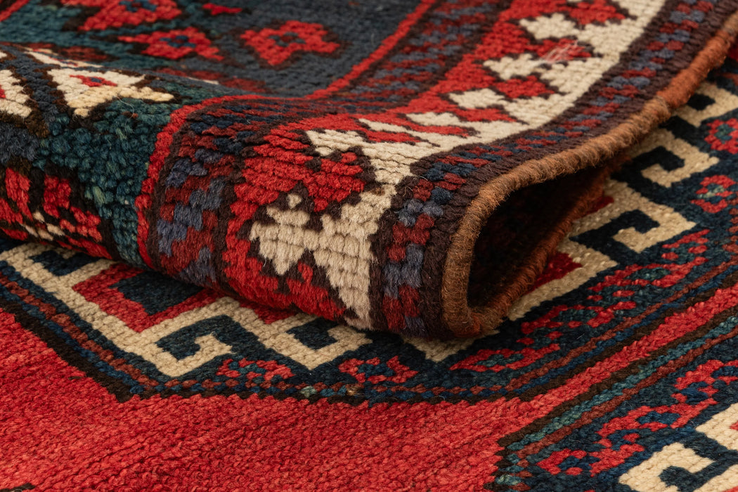 312 x 100 Kurden Teppich alt